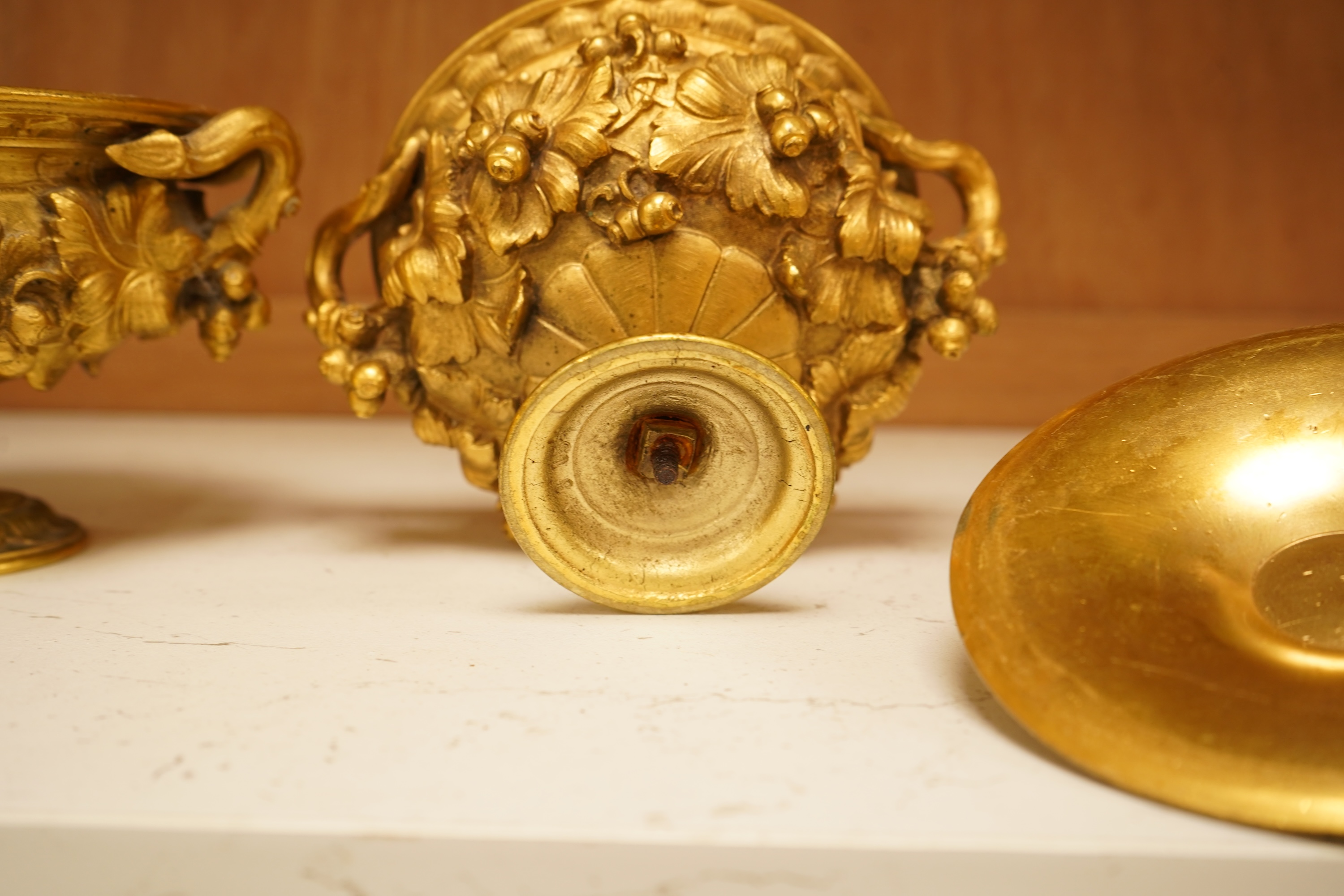 A pair of 19th century French ormolu lidded urns, 12cm
